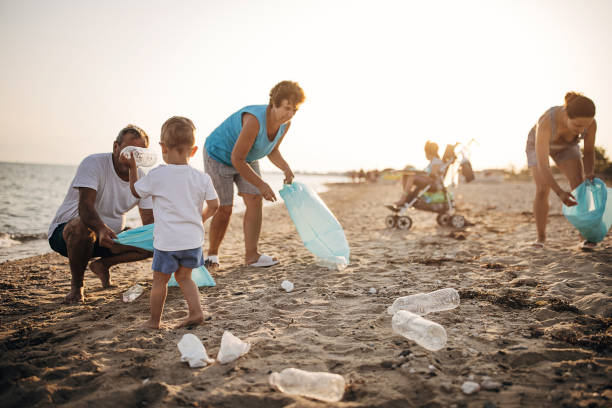 Family and child participating in a beach clean