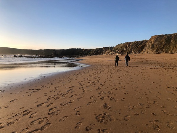 Scenic image of Carnivan beach with cliffs and ocean